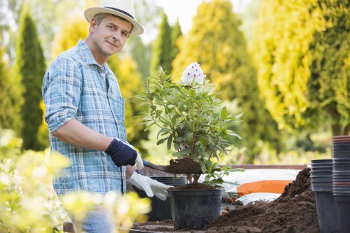 Landscapers Cricklewood using PPE and safe working practices on a garden site